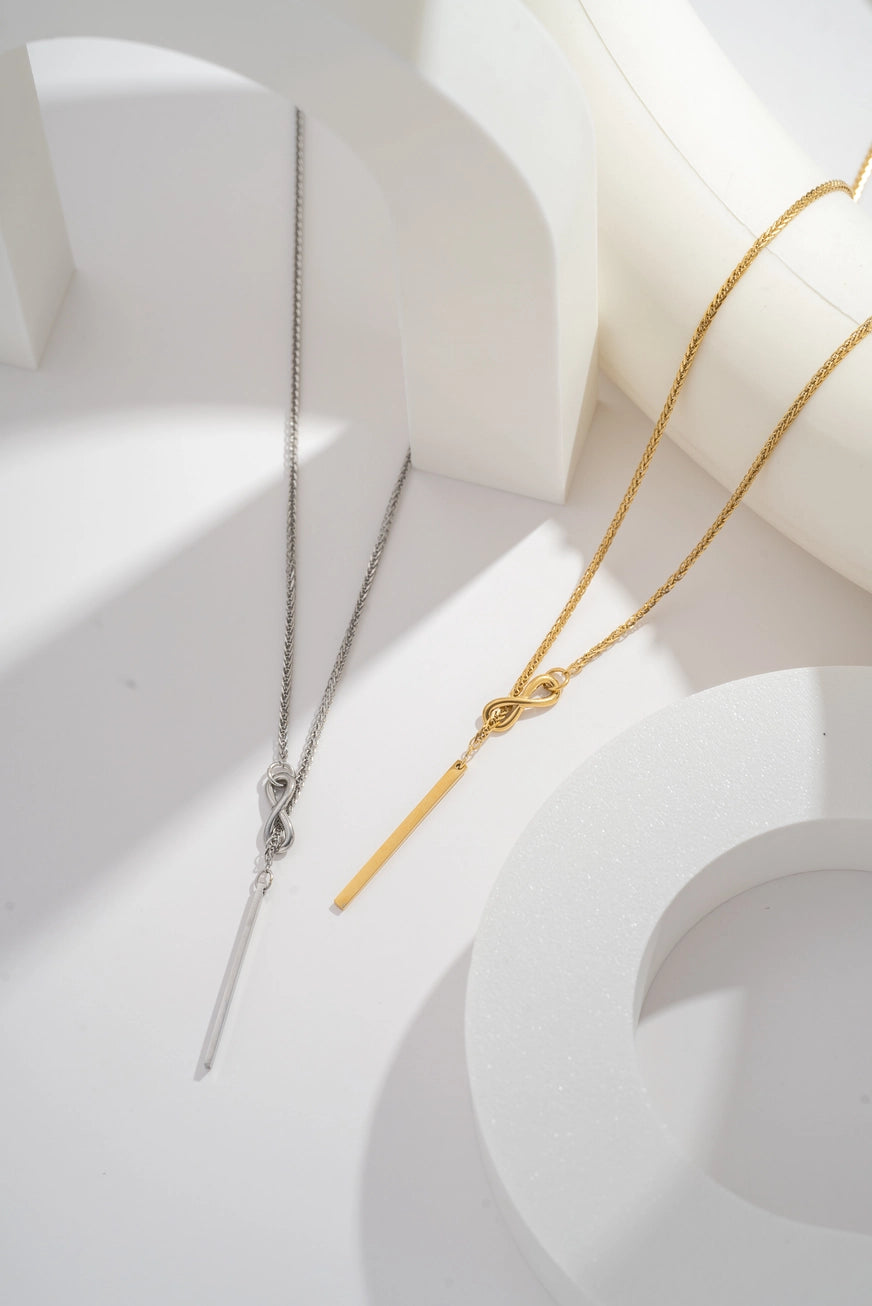 Collana Nodo Eterno in acciaio inossidabile oro/argento – collana minimal con pendente nodo e barra